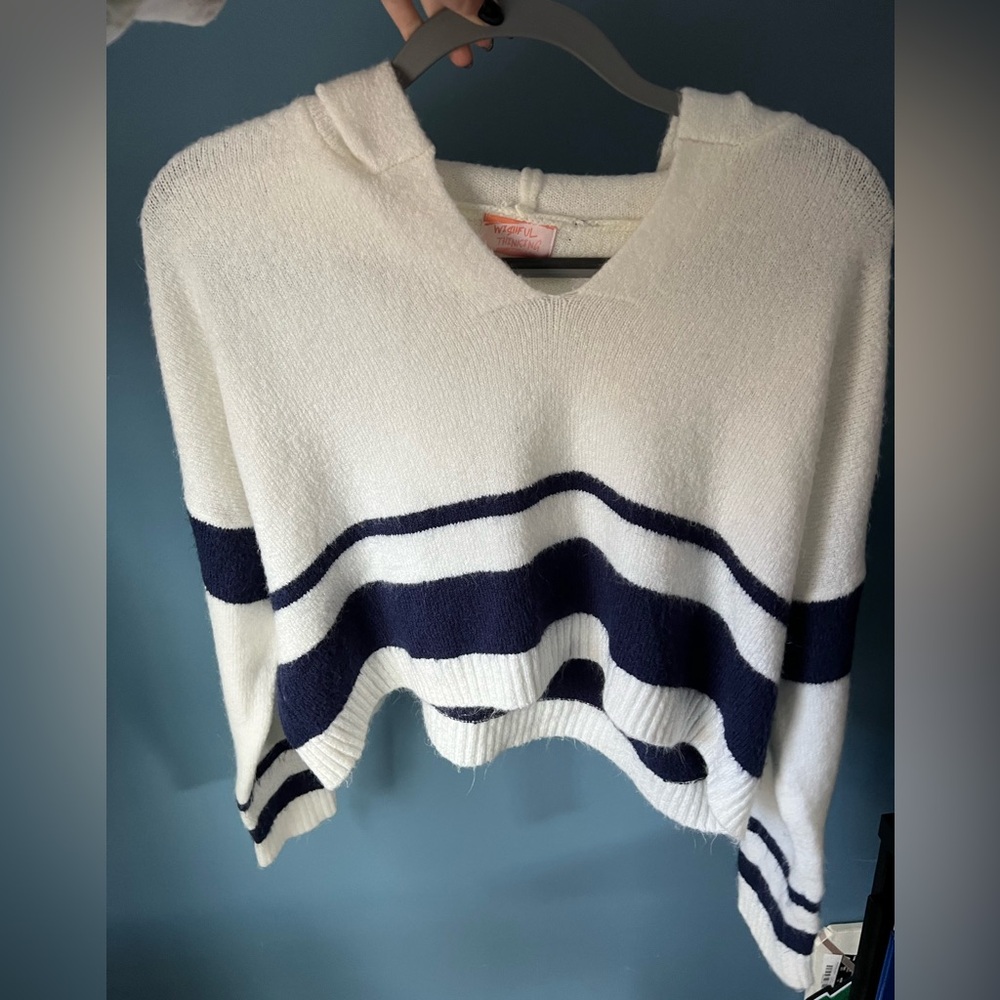 Cozy navy and white striped sweater with hood, slightly cropped.